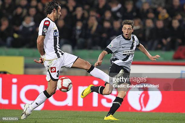 Damiano Ferronetti of Udinese Calcio battles for the ball with Claudio Marchisio of Juventus FC during the Serie A match between Udinese Calcio and...