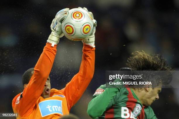 Porto´s goalkeeper from Brazil Helton Arruda catches a ball close Maritimo´s brazilian forward Kleber Pinheiro during their Portuguese first league...