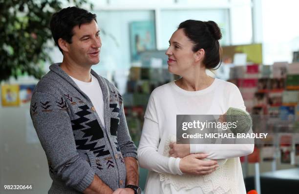 New Zealand Prime Minister Jacinda Ardern and partner Clarke Gayford pose with their baby daugther Neve Te Aroha Ardern Gayford outside the hospital...