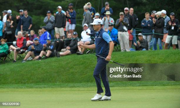 Zach Johnson acknowledges the gallery on the sixth hole during the third round of the Travelers Championship at TPC River Highlands on June 23, 2018...