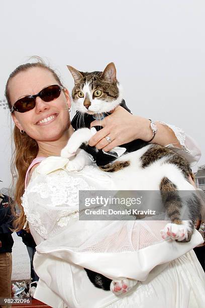 Bride Daria holds the Groom in his tux, Jack a 16 month old cat as they attend the Woofin' Paws Pet Fashion Show at Carey Stadium on April 3, 2010 in...