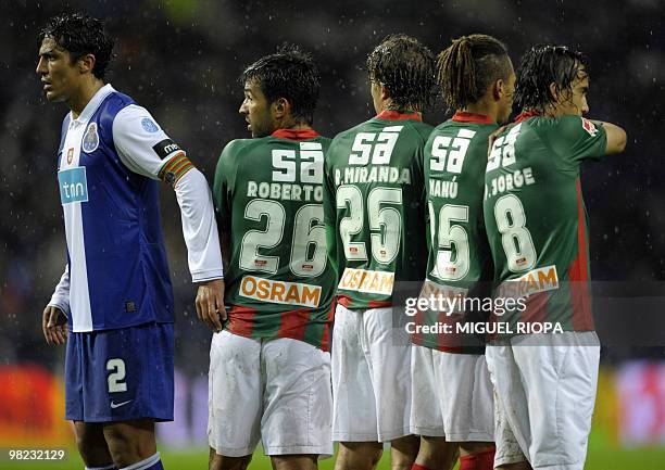 Porto´s defender Bruno Alves is pictured with Maritimo´s brazilian midfielder Roberto Sousa, brazilian midfielder Rafael Miranda, forward Emanuel...