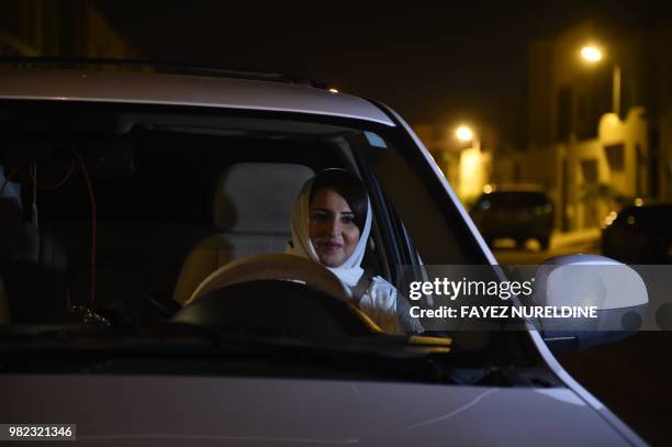 Saudi Samar Almogren prepares to drive her car through Riyadh city's streets for the first time just after midnight, June 24 when the law allowing...