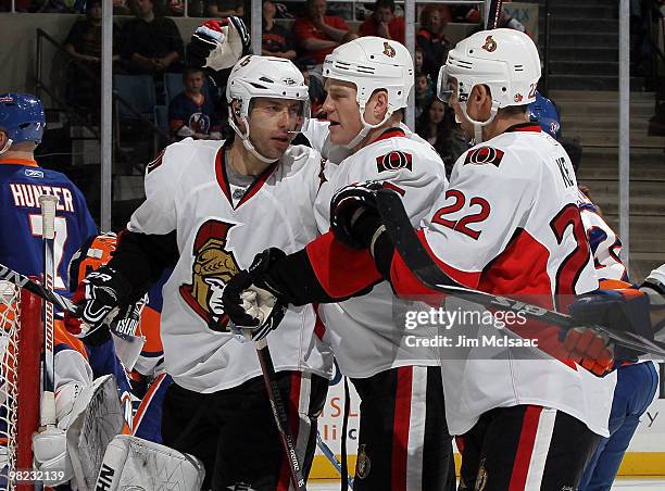 Matt Cullen of the Ottawa Senators celebrates his goal against the New York Islanders with teammates Chris Neil and Chris Kelly on April 3, 2010 at...