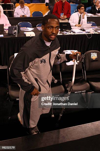 Injured guard Kalin Lucas of the Michigan State Spartans arrives at the court on crutches against the Butler Bulldogs during the National Semifinal...