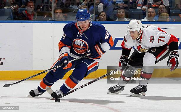 Dylan Reese of the New York Islanders skates against Nick Foligno of the Ottawa Senators on April 3, 2010 at Nassau Coliseum in Uniondale, New York.