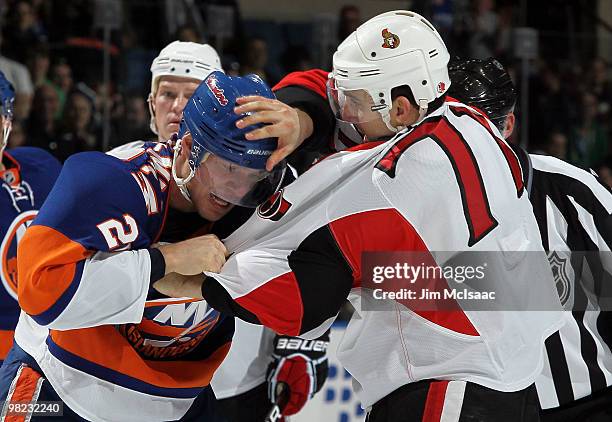 Nick Foligno of the Ottawa Senators trades punches with Sean Bergenheim of the New York Islanders during their first period fight on April 3, 2010 at...