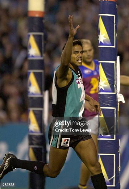 Che Cockatoo-Collins for Port Adelaide celebrates a goal in the Ansett Cup Grand Final between the Brisbane Lions and Port Power played at Football...