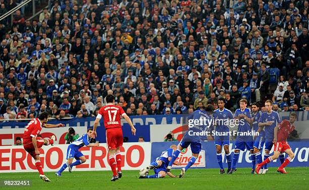 Hamit Altintop of Bayern takes a free kick against a wall of players of Schalke during the Bundesliga match between FC Schalke 04 and FC Bayern...