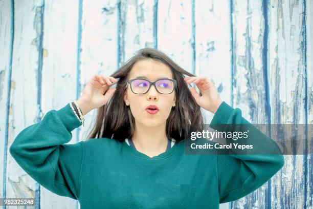 young female woman with eyeglasses making faces - ot coruña fotografías e imágenes de stock