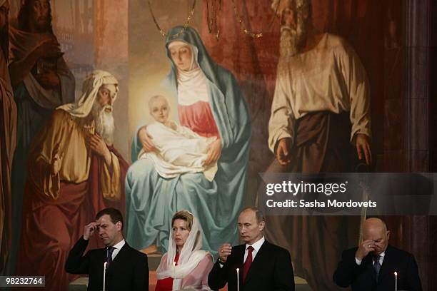 Russian President Dmitry Medvedev, his spouse Svetlana Medvedeva, Prime Minister Vladimir Putin and Moscow's Mayor Yuri Luzhkov attend an Easter...