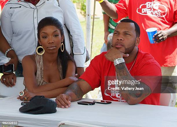 Singer Brandy and rapper Flo Rida attends First Annual Kids Spring and Break into Motivation Event on April 3, 2010 in Miami, Florida.