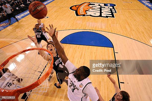 Andrew Smith of the Butler Bulldogs fights for a rebound against Draymond Green of the Michigan State Spartans during the National Semifinal game of...