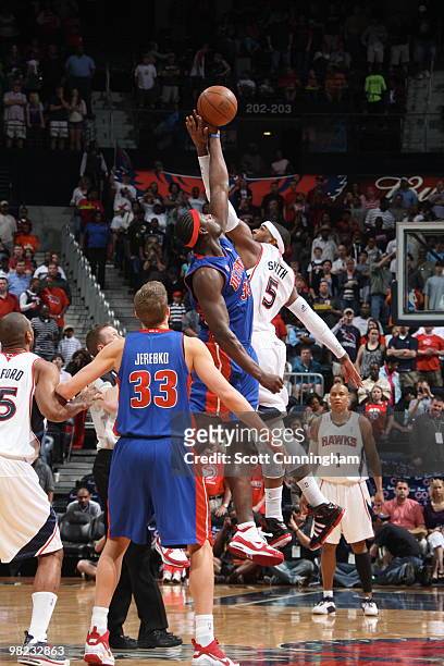 Kwame Brown of the Detroit Pistons jumps against Josh Smith of the Atlanta Hawks on April 3, 2010 at Philips Arena in Atlanta, Georgia. NOTE TO USER:...