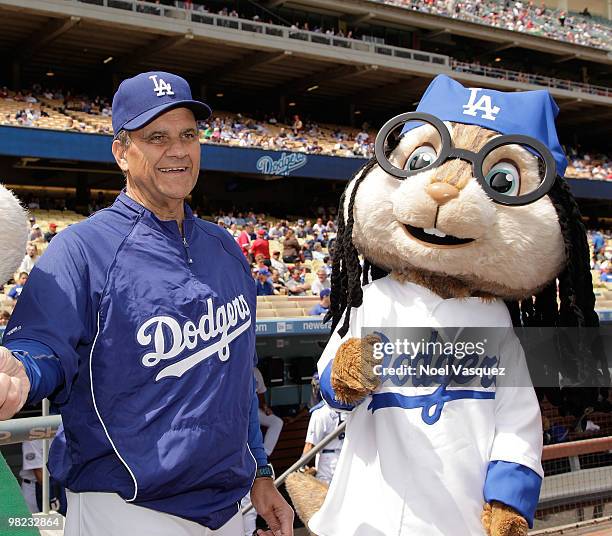 Joe Torre and a person dressed as the character 'Simon' of the Chipmunks attend pre game celebration for "Alvin And The Chipmunks: The Squeakquel"...