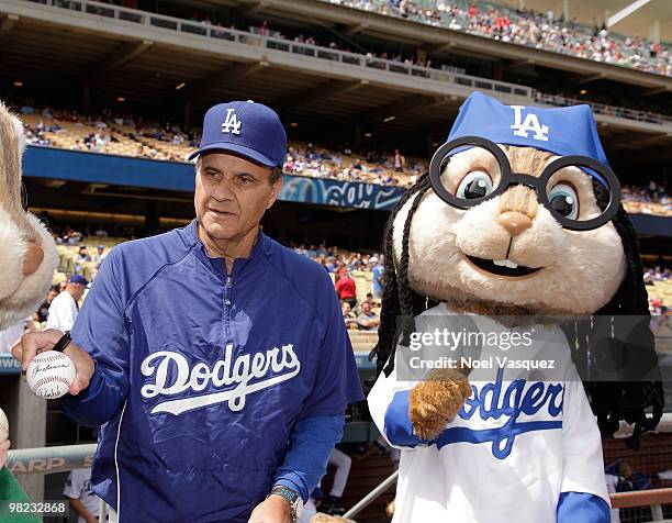 Joe Torre and a person dressed as the character 'Simon' of the Chipmunks attend pre game celebration for "Alvin And The Chipmunks: The Squeakquel"...