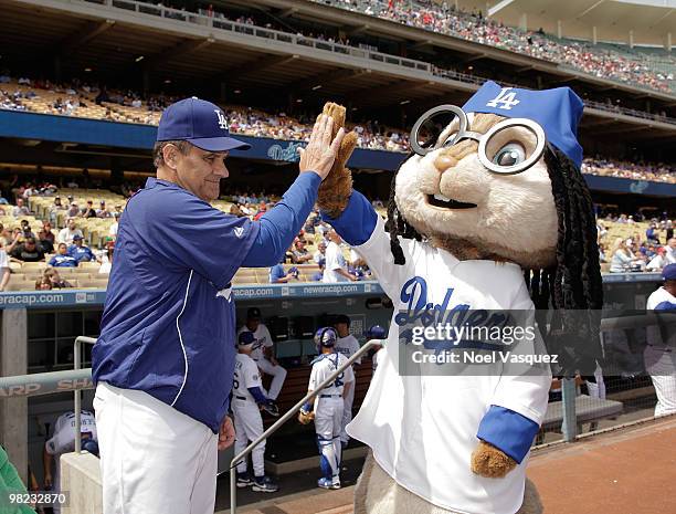 Joe Torre and a person dressed as the character 'Simon' of the Chipmunks attend pre game celebration for "Alvin And The Chipmunks: The Squeakquel"...