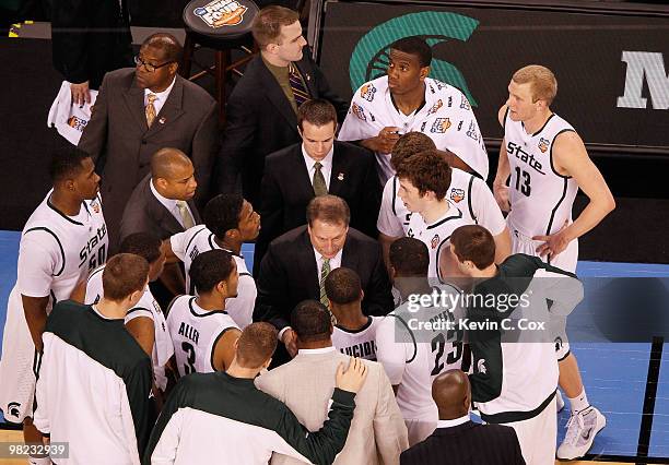 Head coach Tom Izzo of the Michigan State Spartans talks with his team during a timeout in the first half while taking on the Butler Bulldogs during...