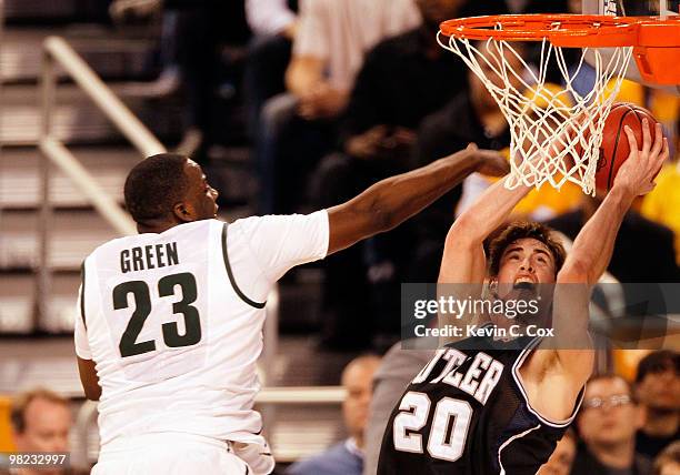 Gordon Hayward of the Butler Bulldogs goes up for a shot against Draymond Green of the Michigan State Spartans in the second half during the National...