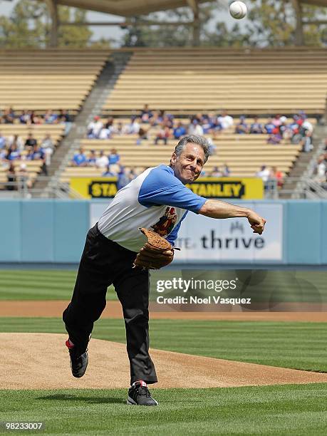 Ross Bagdasarian Jr throws the first pitch at the "Alvin And The Chipmunks: The Squeakquel" DVD promotion at Dodger Stadium on April 3, 2010 in Los...