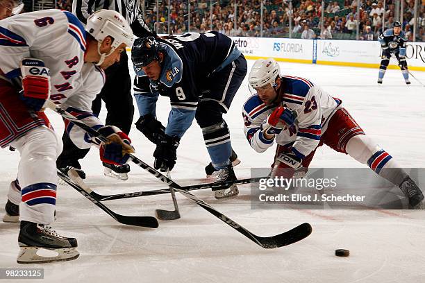 Stephen Weiss of the Florida Panthers faces off against Wade Redden of the New York Rangers and teammate Chris Drury at the BankAtlantic Center on...