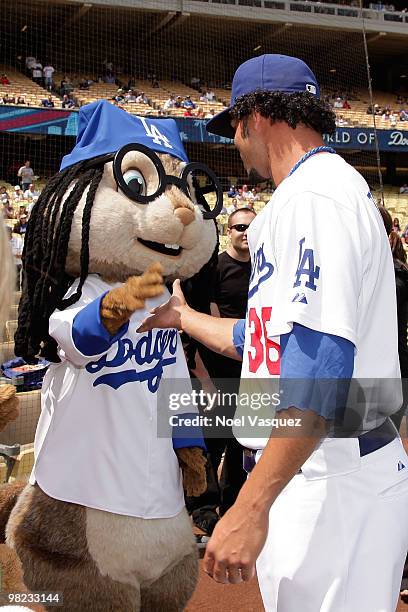 Person dressed as the characters 'Simon' of the Chipmunks greets Los Angeles Dodger Ramon Troncoso at the "Alvin And The Chipmunks: The Squeakquel"...