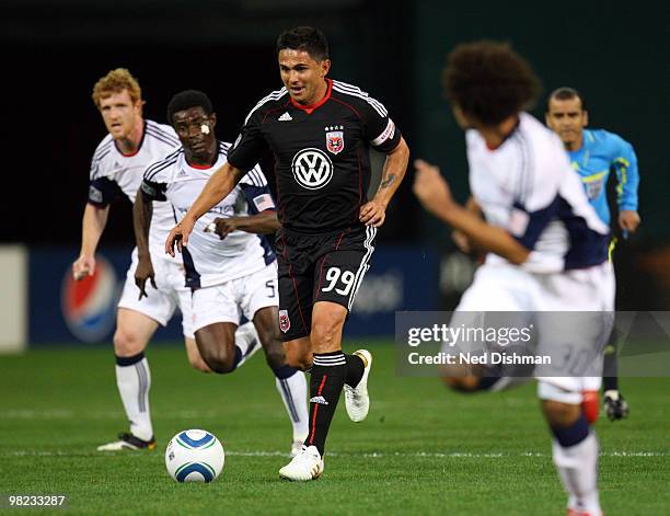 Jaime Moreno of D.C. United controls the ball against Emmanuel Osei of New England Revolution at RFK Stadium on April 3, 2010 in Washington, DC.