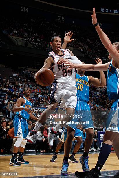 Devin Harris of the New Jersey Nets passes against the New Orleans Hornets during a game on April 3, 2010 at Izod Center in East Rutherford, New...