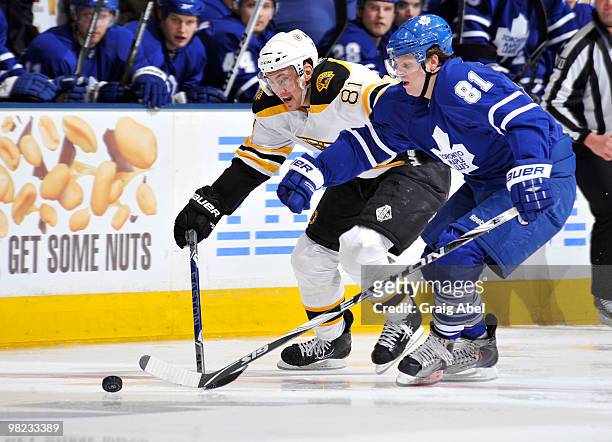 Phil Kessel of the Toronto Maple Leafs battles for the puck with Miroslav Satan of the Boston Bruins during game action April 3, 2010 at the Air...