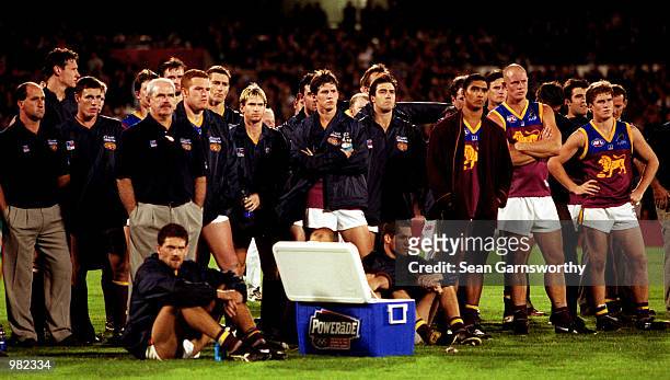 The Brisbane Lions team looks dejected after losing the Ansett Cup Grand Final between Port Adelaide Power and Brisbane Lions at Football Park in...