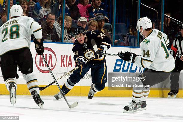 Oshie of the St. Louis Blues clears the puck as Mark Fistric and Jamie Benn of the Dallas Stars defend on April 03, 2010 at Scottrade Center in St....