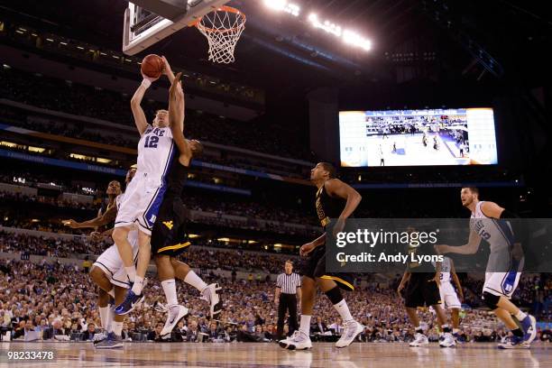 Kyle Singler of the Duke Blue Devils drives for a shot attempt in the first half against the West Virginia Mountaineers during the National Semifinal...