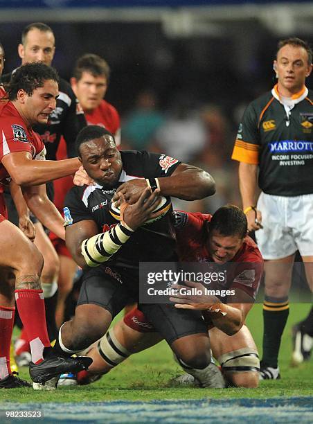 Tendai Mtawarira of the Sharks tackled by Scott Higginbotham of the Reds during the Super 14 match between Sharks and Reds from Absa Stadium on April...