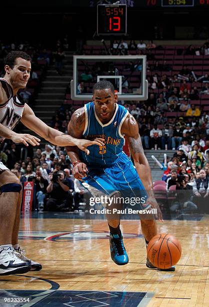 Marcus Thornton of the New Orleans Nets drives against Kris Humphries of the New Jersey Nets during a game on April 3, 2010 at Izod Center in East...