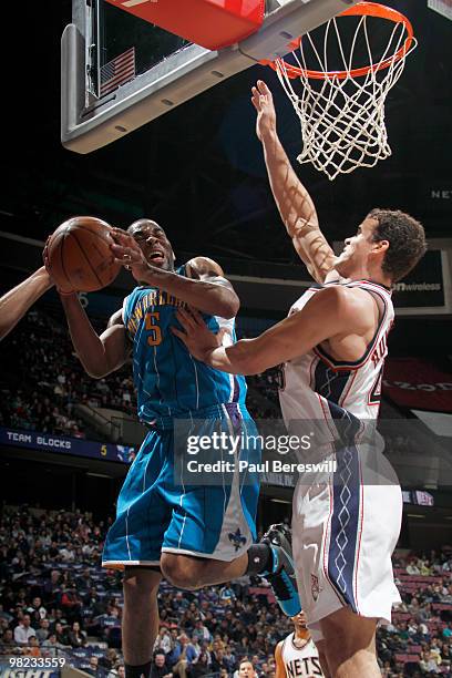 Marcus Thornton of the New Orleans Nets shoots against Kris Humphries of the New Jersey Nets during a game on April 3, 2010 at Izod Center in East...