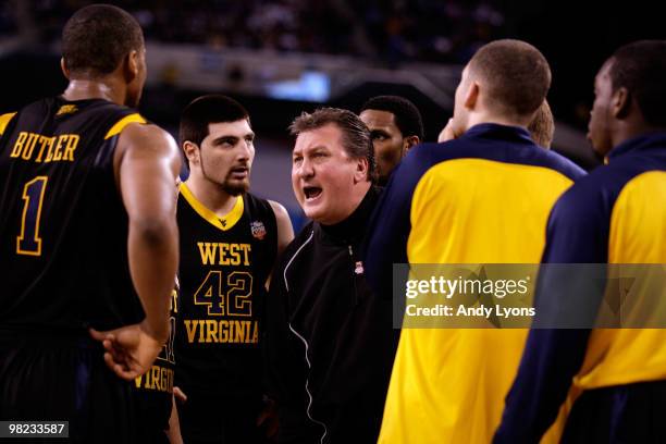 Head coach Bob Huggins of the West Virginia Mountaineers yells at his players during a timeout in the first half against the Duke Blue Devils during...