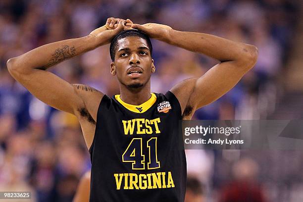 John Flowers of the West Virginia Mountaineers walks on the court with his hands on his head in the first half against the Duke Blue Devils during...