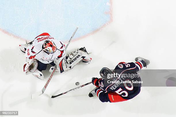 Goaltender Jose Theodore of the Washington Capitals stops a shot from Antoine Vermette of the Columbus Blue Jackets on April 3, 2010 at Nationwide...