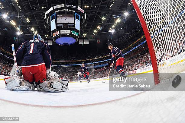 Goaltender Steve Mason of the Columbus Blue Jackets is unable to stop the game winning shot from Mike Green of the Washington Capitals on April 3,...