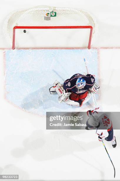 Brooks Laich of the Washington Capitals screen goaltender Steve Mason of the Columbus Blue Jackets as the game winning shot from Mike Green of the...