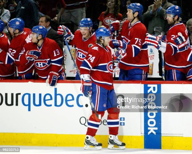 Sergei Kostitsyn of the Montreal Canadiens celebrates his third period goal with team mates during the NHL game against the Buffalo Sabres on April...