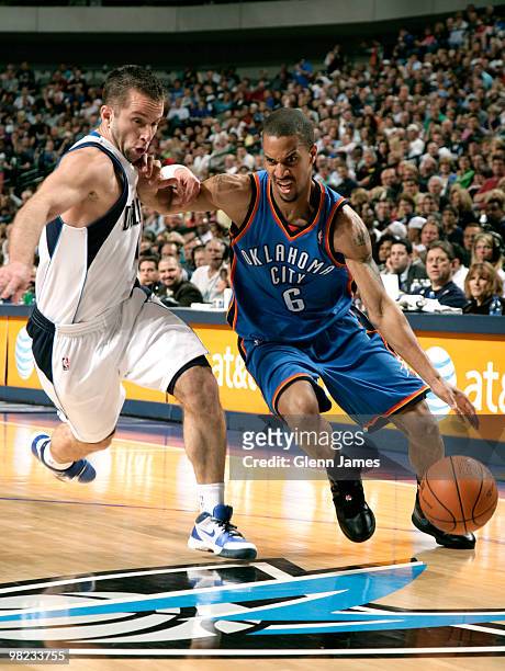 Eric Maynor of the Oklahoma City Thunder drives against Jose Juan Barea of the Dallas Mavericks during a game at the American Airlines Center on...