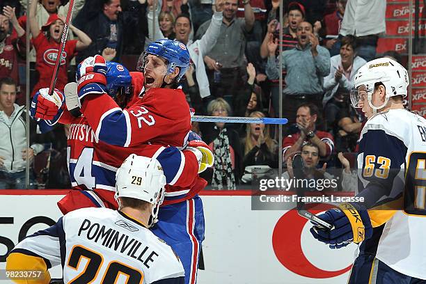 Sergei Kostitsyn of Montreal Canadiens celebrates his goal with teammate Travis Moen during the NHL game against the Buffalo Sabres on April 3, 2010...