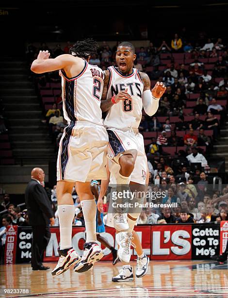Terrence Williams and Josh Boone of the New Jersey Nets celebrate near the end of a victory against the New Orleans Hornets during a game on April 3,...