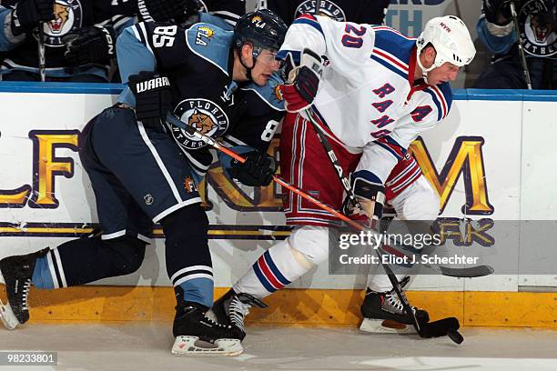 Rostislav Olesz of the Florida Panthers tangles with Vinny Prospal of the New York Rangers at the BankAtlantic Center on April 3, 2010 in Sunrise,...