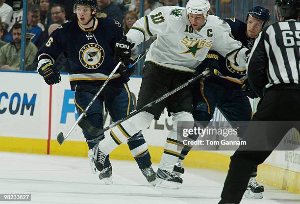 Brenden Morrow of the Dallas Stars checks Jay McClement of the St. Louis Blues on April 03, 2010 at Scottrade Center in St. Louis, Missouri.