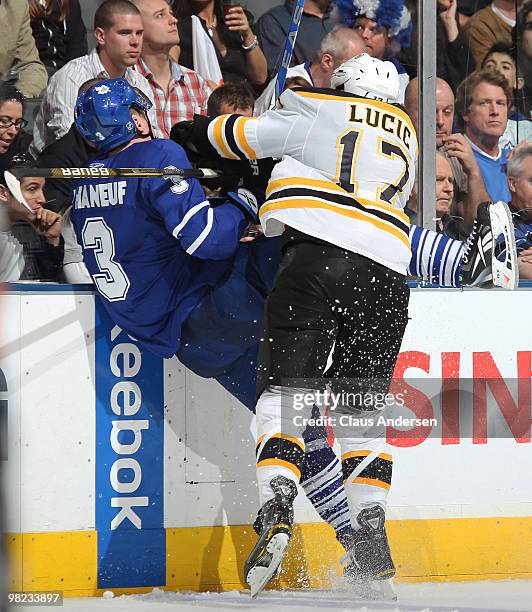 Milan Lucic of the Boston Bruins hammers Dion Phaneuf of the Toronto Maple Leafs into the boards in a game on April 3, 2010 at the Air Canada Centre...