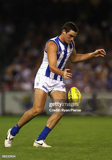 Nathan Grima of the Kangaroos kicks during the round two AFL match between the St Kilda Saints and the North Melbourne Kangaroos at Etihad Stadium on...
