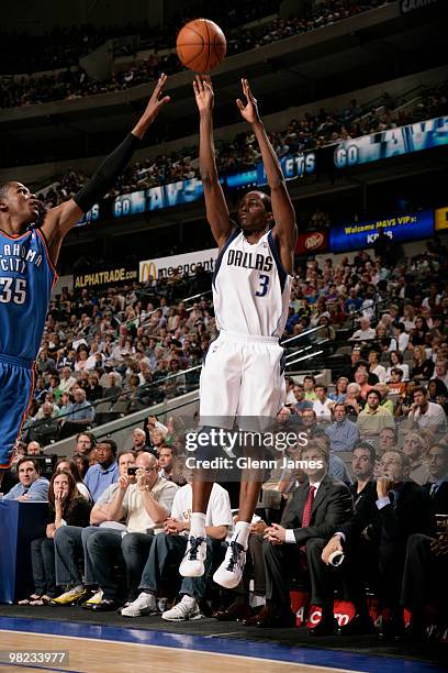 Rodrigue Beaubois of the Dallas Mavericks shoots a jumper against Kevin Durant of the Oklahoma City Thunder during a game at the American Airlines...