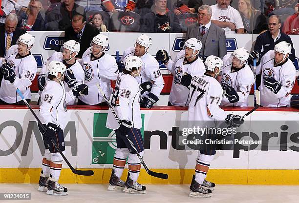 Ryan Jones of the Edmonton Oilers celebrates with teammates on the bench after scoring a first period goal against the Phoenix Coyotes during the NHL...
